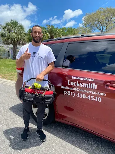 Sunshine Mobile Locksmith technician providing commercial locksmith services in Melbourne FL with company van