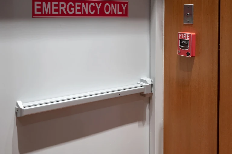 Commercial emergency exit door with push bar installed by our locksmith