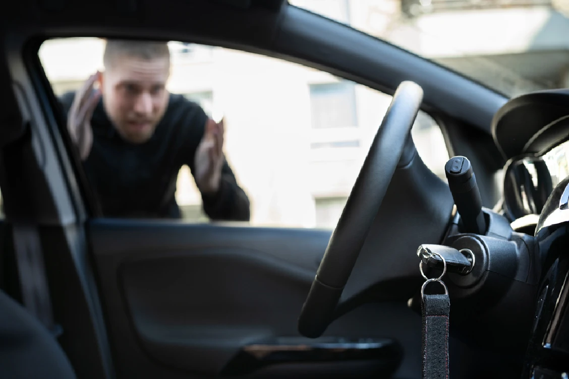 A person staring at his key locked his car in Melbourne, FL
