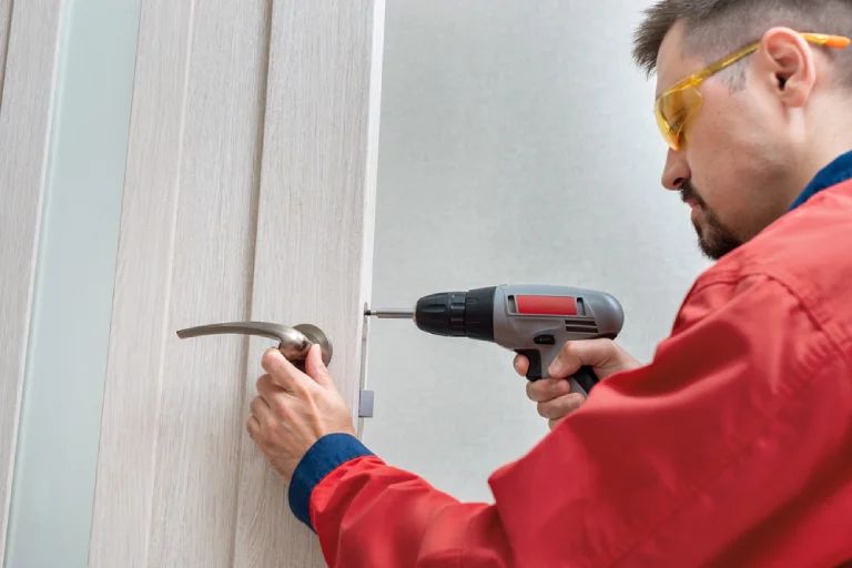 Emergency locksmith in Melbourne FL repairing door lock with fast mobile service available nights and weekends.