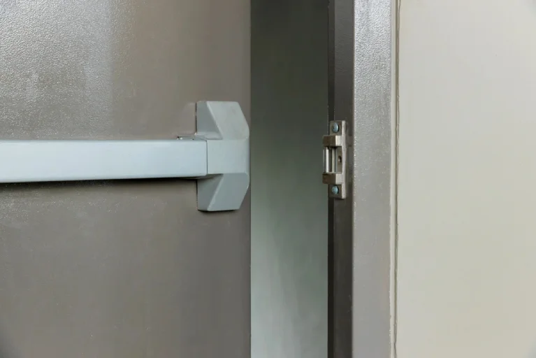 Commercial fire-rated door with metallic panic bar.