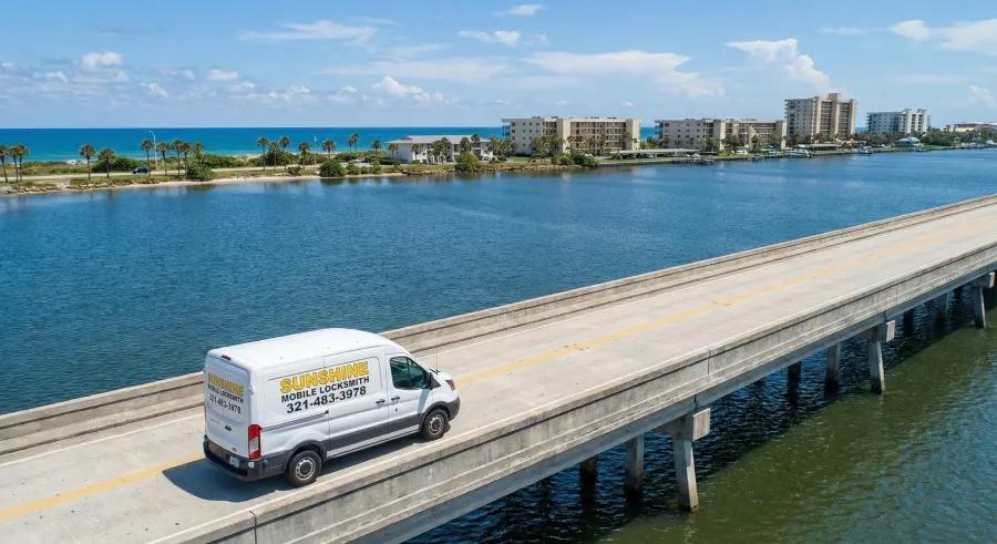 Sunshine Mobile Locksmith Ford service van driving across a causeway bridge connecting Melbourne to the coast in Brevard County, FL.